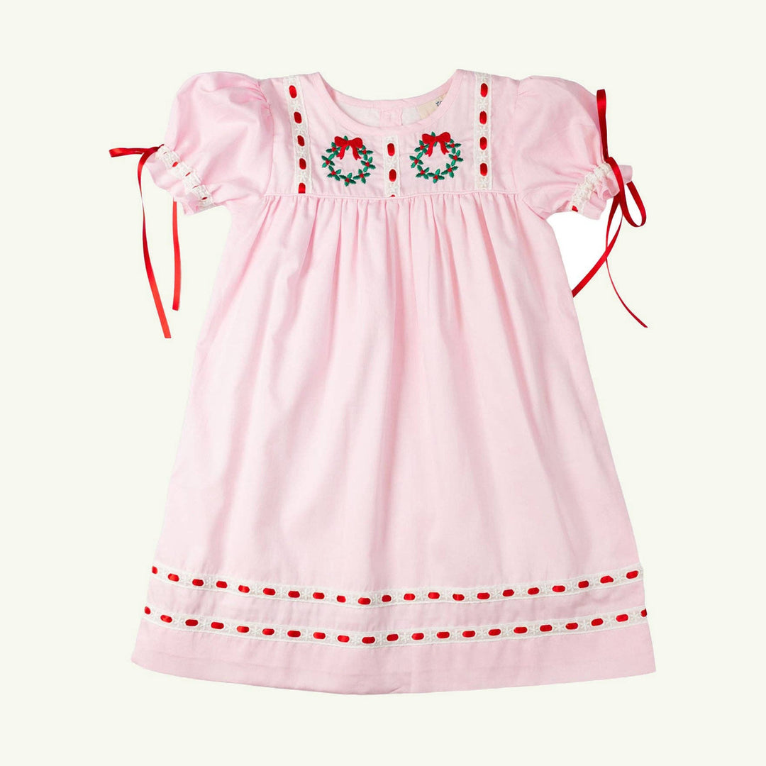 wreath with bows heirloom dress on stork